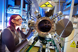 A physicist working on a piece of equipment