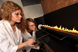 Physics students looking at an experiment