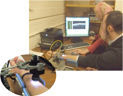 PhD students designing an optical coherence spectroscope for looking at vessels within the skin